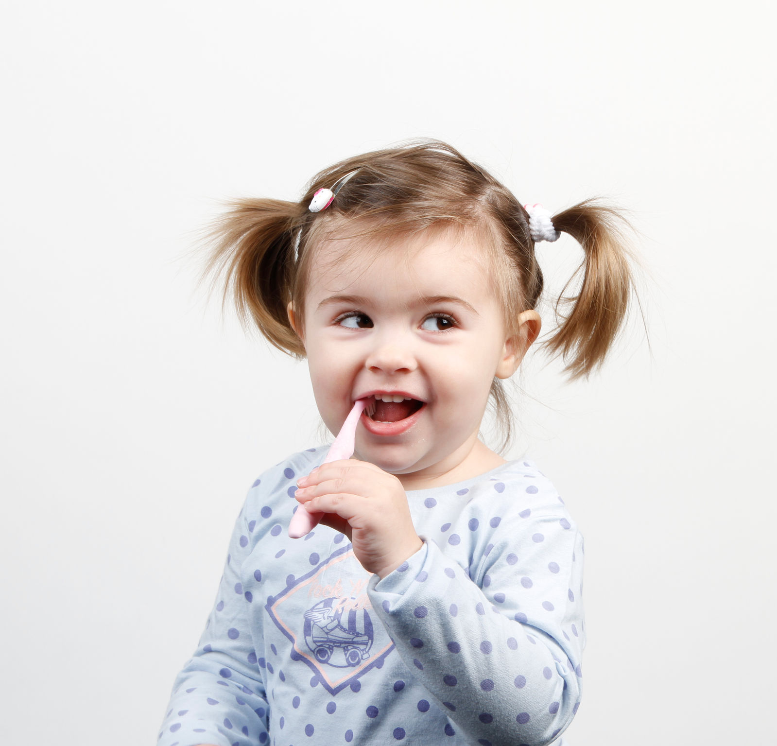 baby with toothbrush